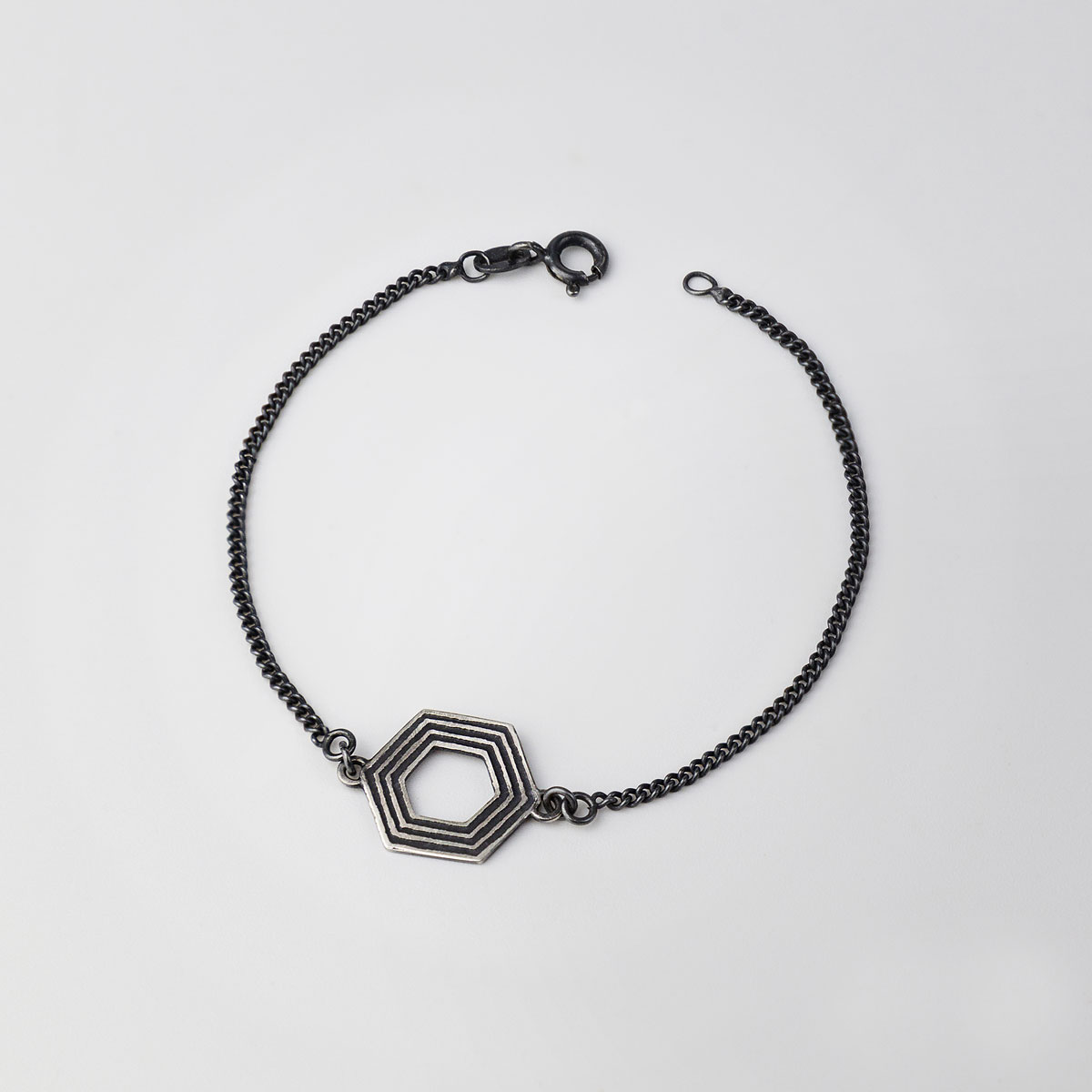 ‘Lines in Motion’ Silver and Black Hexagonal Bracelet