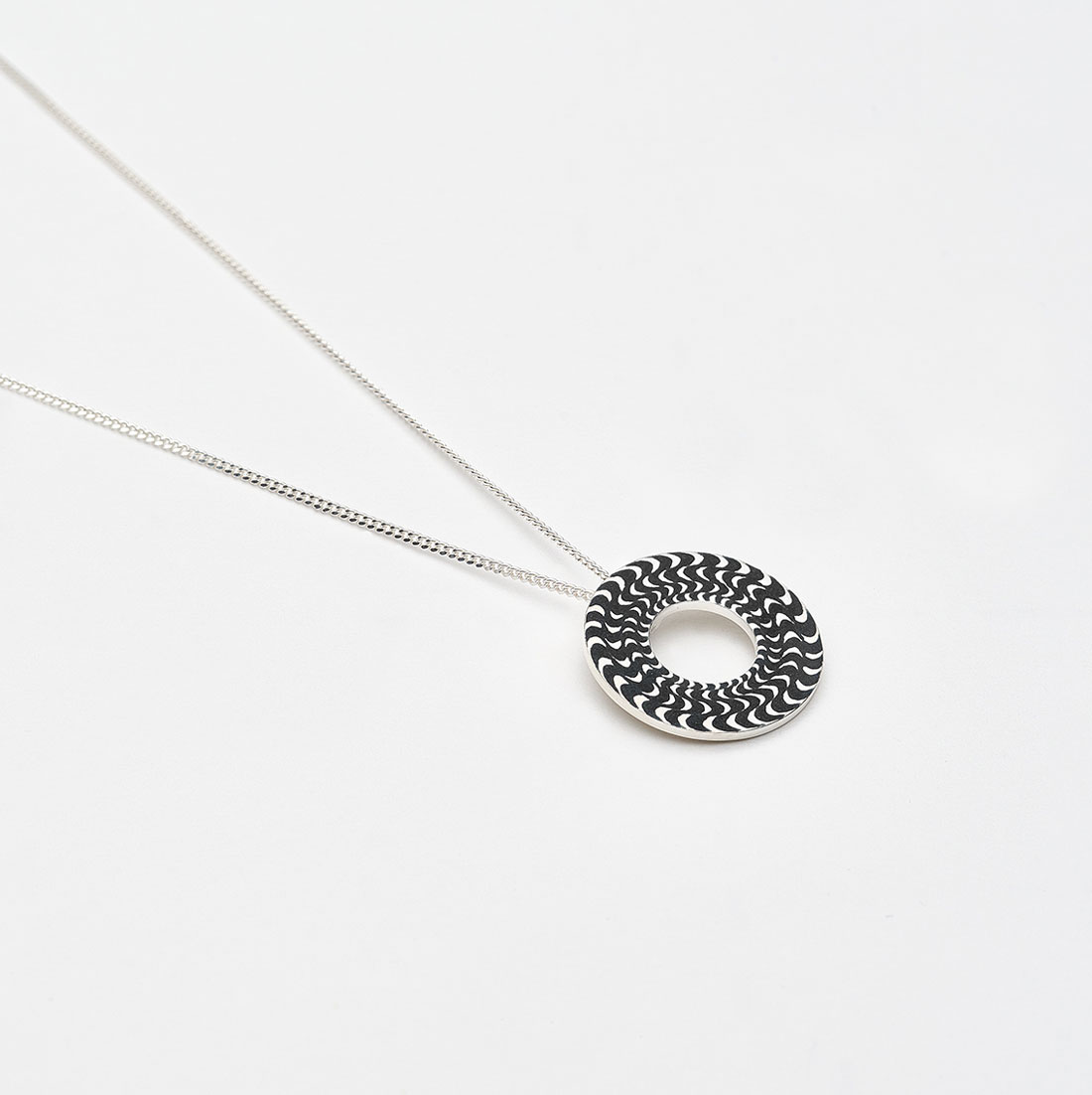 ‘Finesse’ Silver and Black Circular Pendant