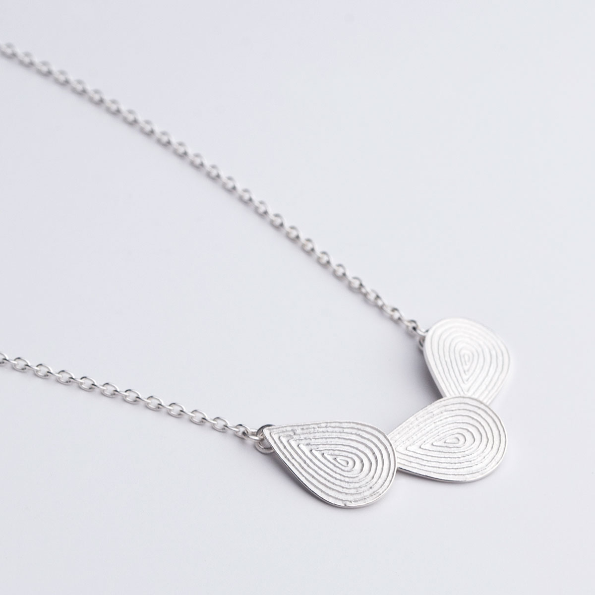 ‘Lines in Motion’ Silver Triple Teardrop Necklace